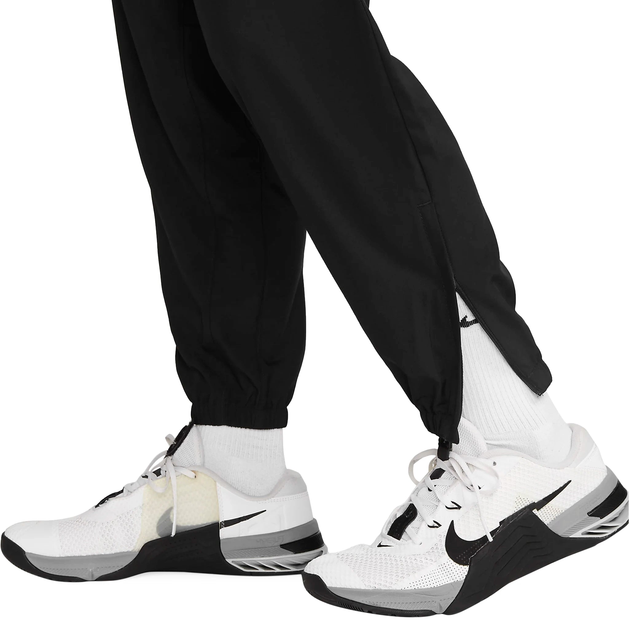 Model leg view of Nike Challenger Black Pants